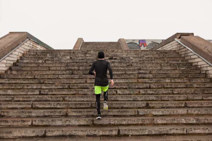 man-running-up-stairs