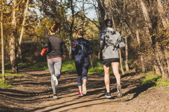 rear-view-people-running-park