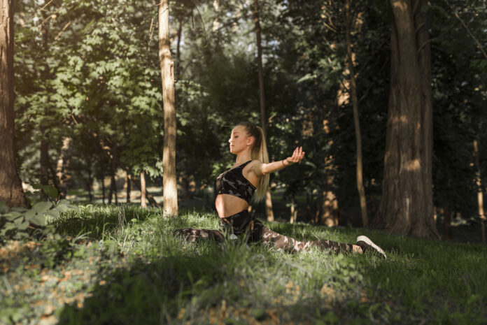 young-woman-doing-yoga-park